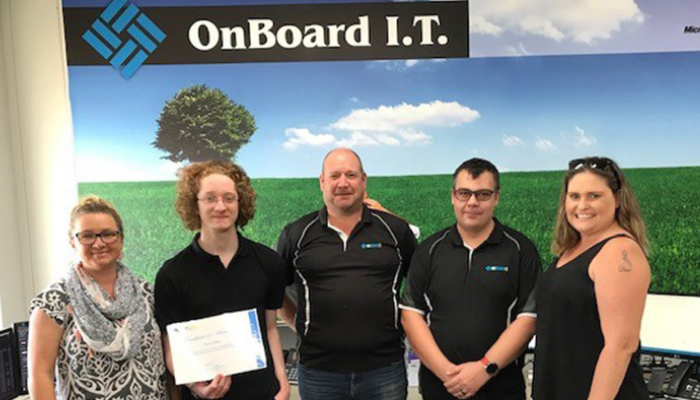Photo of Dain at his I.T. internship