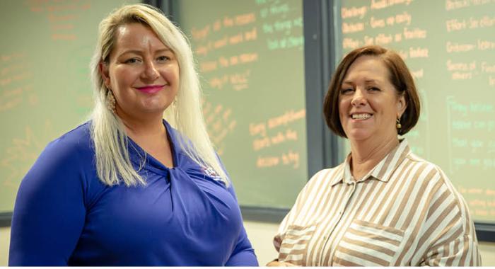 Glenda standing with her Career Transition Assistance facilitator