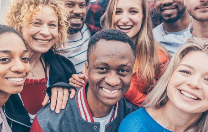 group of people smiling at the camera