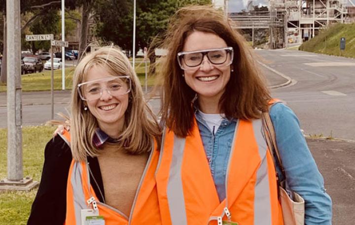 Two women in high vis with safety goggles