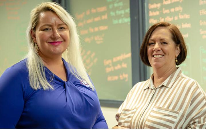 Glenda standing with her Career Transition Assistance facilitator