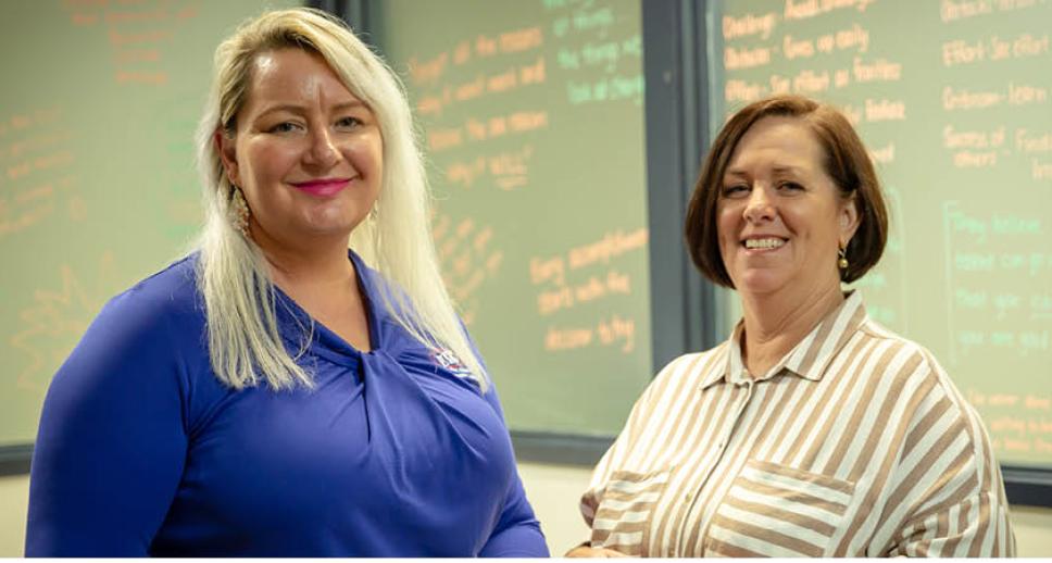 Glenda standing with her Career Transition Assistance facilitator