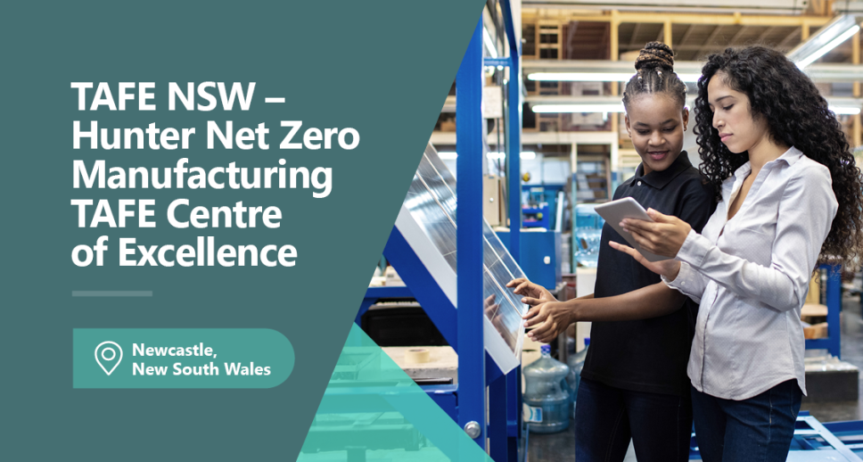 2 people standing in a warehouse